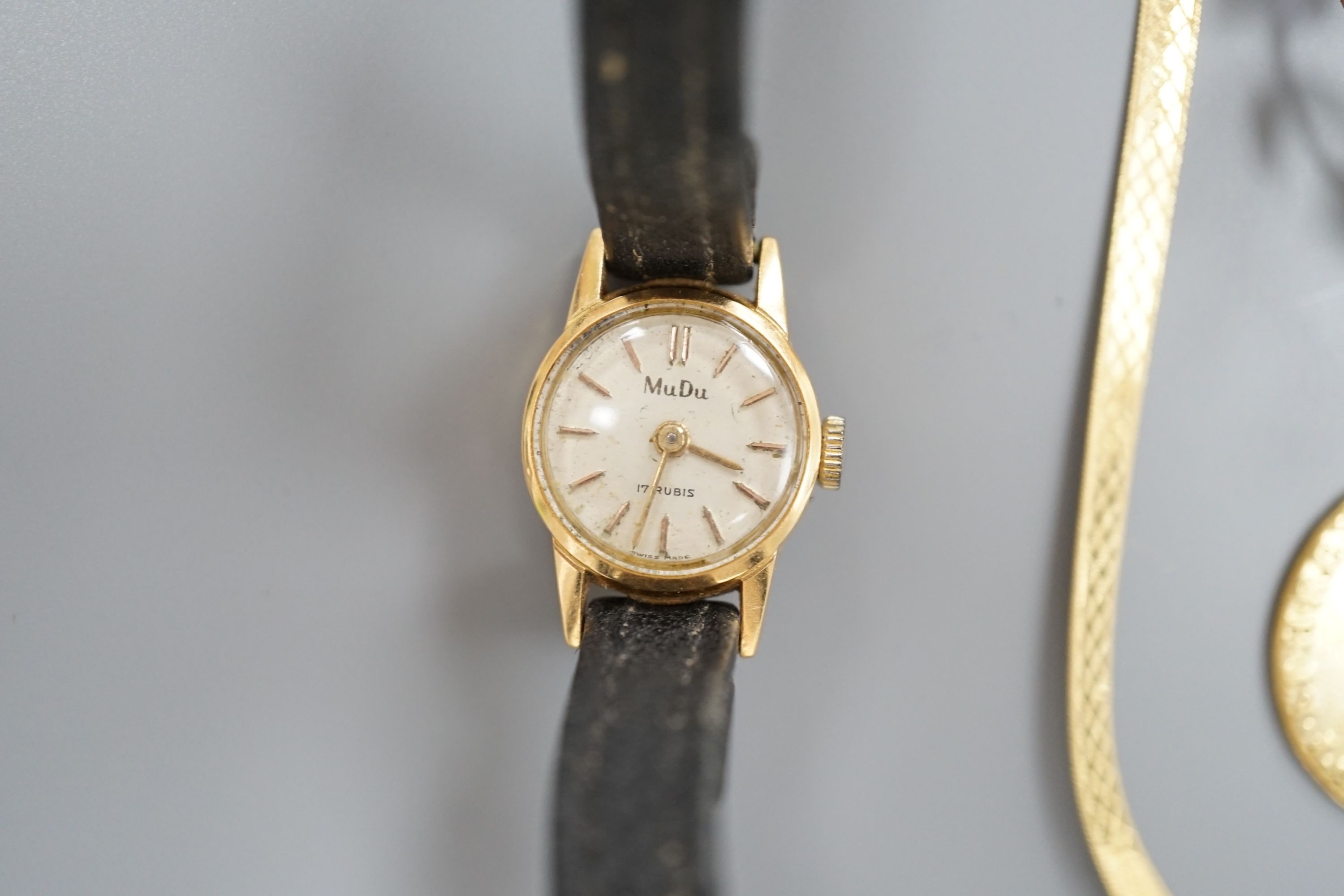 A modern 9ct gold necklet, 4.2 grams, a 14kt bracelet and necklace gross 3 grams, a worn gold coin, a yellow metal and gem set brooch, a similar fox head stick pin and a lady's 18ct Mudu wrist watch.